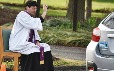 With churches closing, US priest offers drive thru confessions